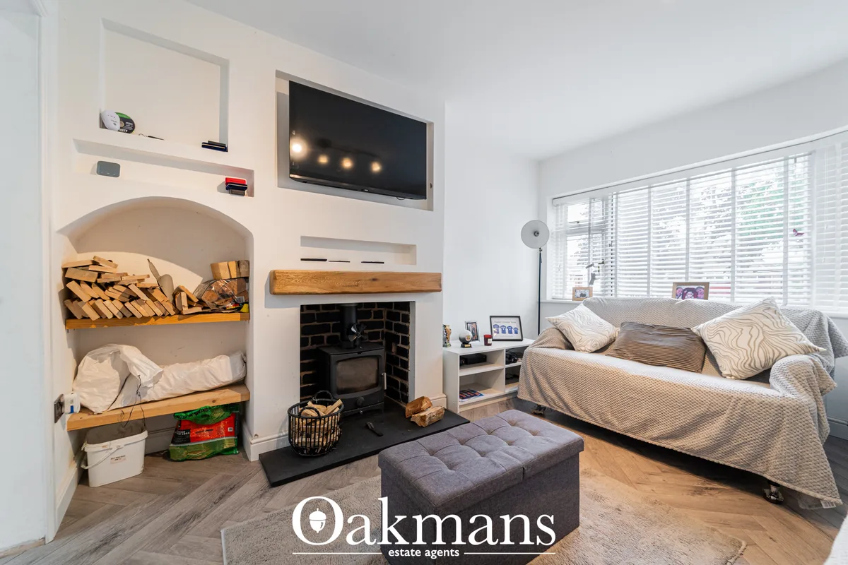 Bright bedroom with double bed, built-in bunk beds, fireplace, TV wall, wooden flooring and shuttered windows